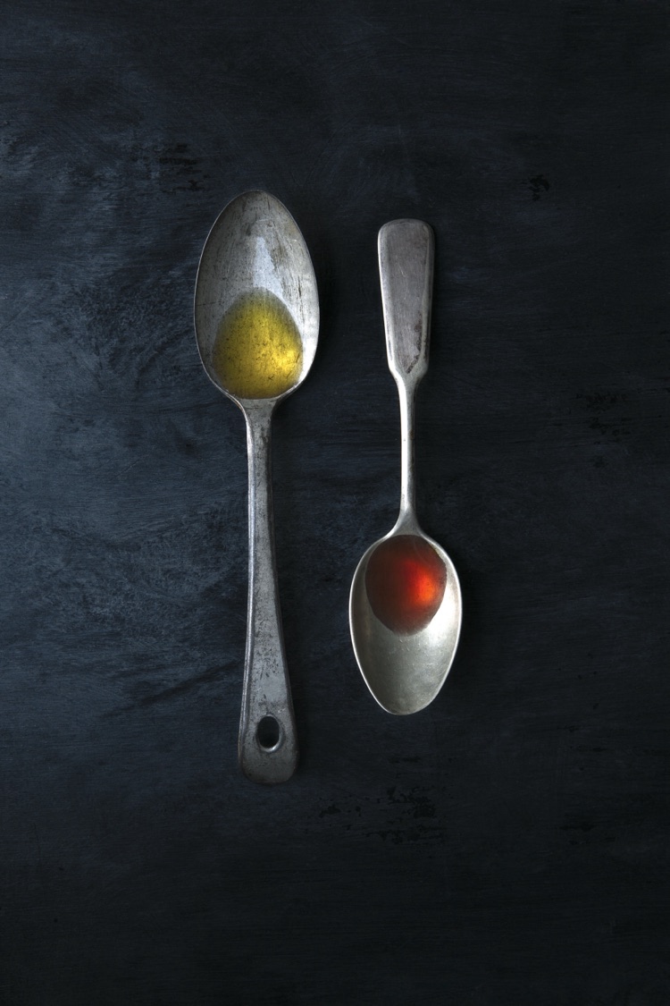Olive oil and red wine vinegar on vintage spoons